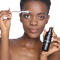 Black model is applying the Shampoo with a brush